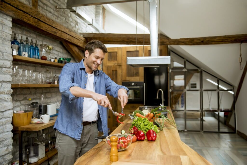 Young man preparing food in the kitchen